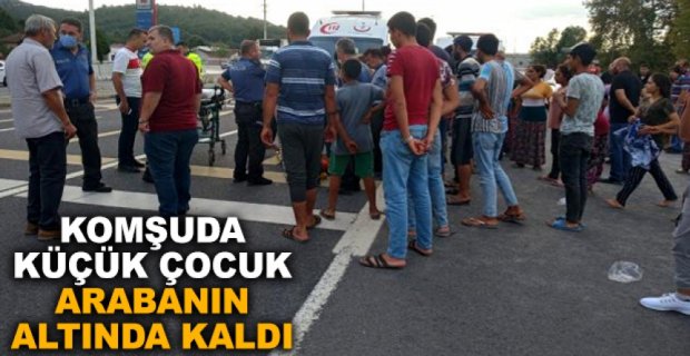 KÜÇÜK ÇOCUK ARABANIN ALTINDA KALDI